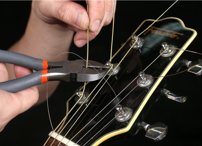 Cách Thay Dây Đàn Guitar Acoustic Chuẩn Nhất